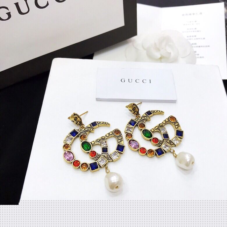 G*u*i earrings